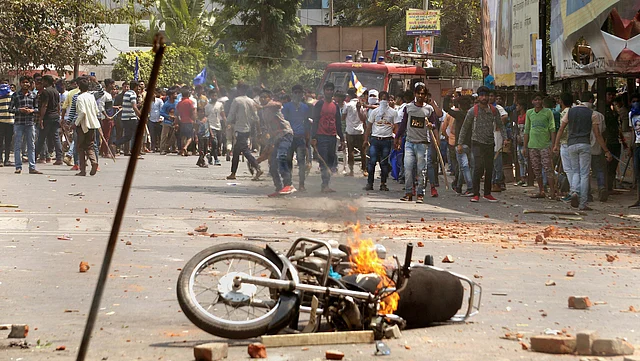 A bike set on fire by a group of protesters during Bharat Bandh call given by Dalit organisations against the alleged dilution of SC/ST Act, in Meerut on 2 April 2018.