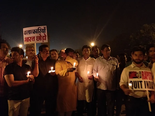 “Rapists, Leave India!” protesters at the midnight rally demanded.
