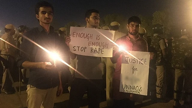 Public demanding justice for the 8-year-old at a candlelight vigil at India Gate, New Delhi. 