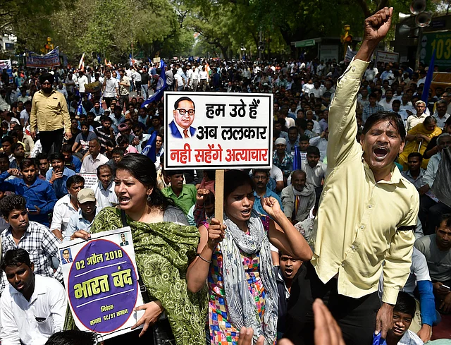 Members of the Dalit community raise slogans during Bharat Bandh against the alleged dilution of SC/ST Act in New Delhi, on 2 April 2018.