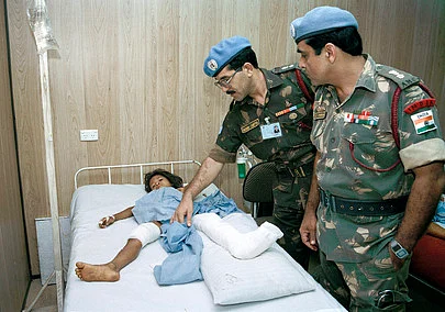 Indian doctors treat a Cambodian girl at their hospital in Sung Treng.