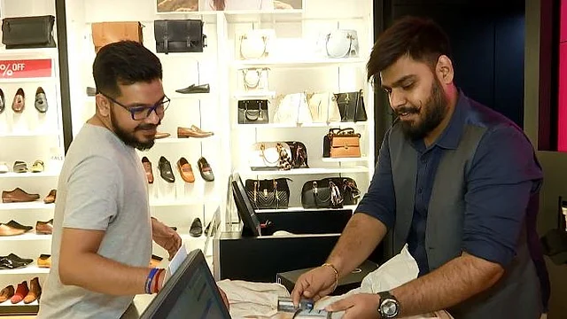 Sammy (L) uses multiple credit cards to suit his lifestyle.