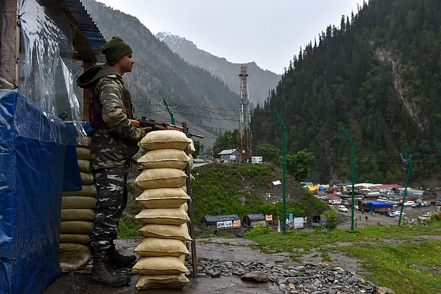 CRPF personnel stands guard near Amarnath base camp at Baltal, in Ganderbal district of central Kashmir on Thursday, 28 June.