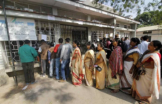 People queue outside NRC Seva Kendra to check names of themselves and family members in a draft for National Register of Citizens (NRC). 