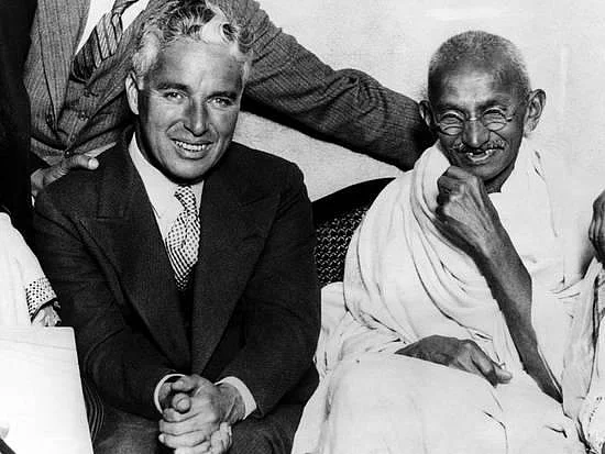 Charlie Chaplin with Mahatma Gandhi.