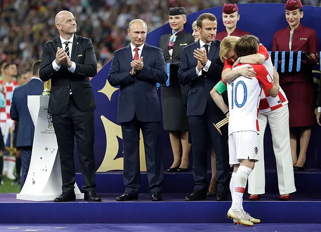 Croatian President Kolinda Grabar-Kitarovic embraces Croatia’s Luka Modric after he received the player of the tournament award after the final match between France and Croatia at the 2018 soccer World Cup in the Luzhniki Stadium in Moscow, Russia, Sunday, July 15, 2018. France won the final 4-2