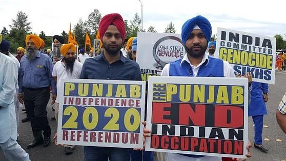 SFJ Protesters holding placards promoting ‘Referendum 2020.’ 