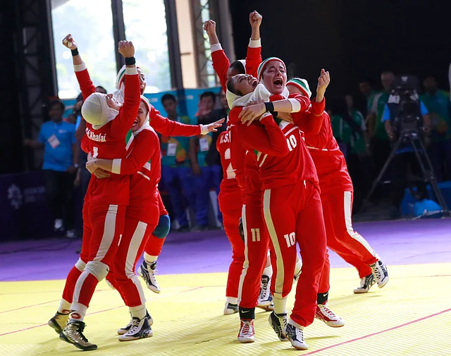 Iran’s team, in red, react after defeating India in the women’s kabaddi gold medal match at the 18th Asian Games in Jakarta, Indonesia.