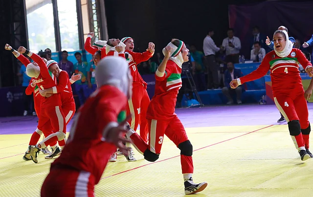 Iran’s team, in red, react after defeating India in the women’s kabaddi gold medal match at the 18th Asian Games in Jakarta, Indonesia.