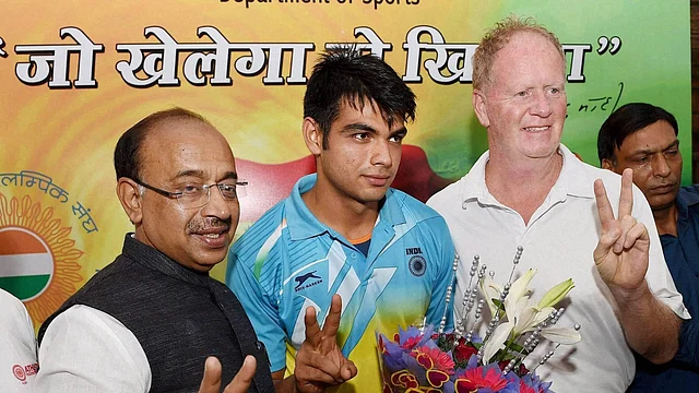 Neeraj with his old coach Gary Calvert at a felicitation ceremony in Delhi following his U20 World Championship win in 2016.