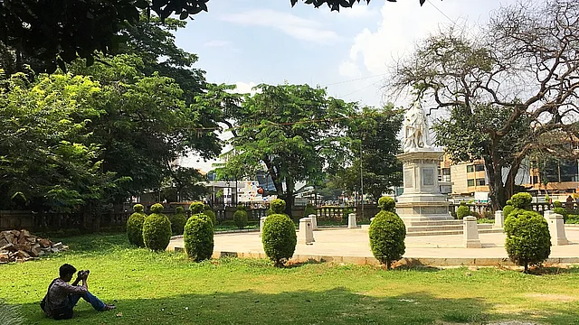 A youngster photographs the statue of King Edward VII, one of the eight statues located all around the park.