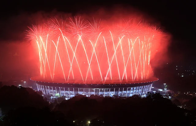 Fireworks explode over the Gelora Bung Karno Stadium during the closing ceremony for the 18th Asian Games at in Jakarta, Indonesia.