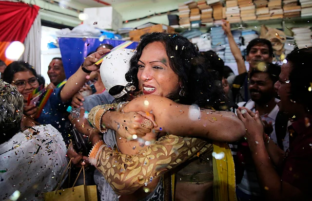 Supporters of the LGBTQ community in Mumbai hug each other following the SC’s verdict.
