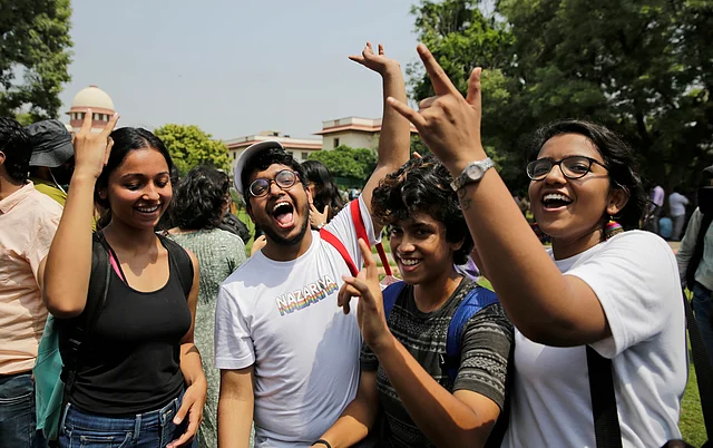 LGBTQ activists celebrate after the country’s top court read down parts of a colonial-era law that made homosexual acts punishable.