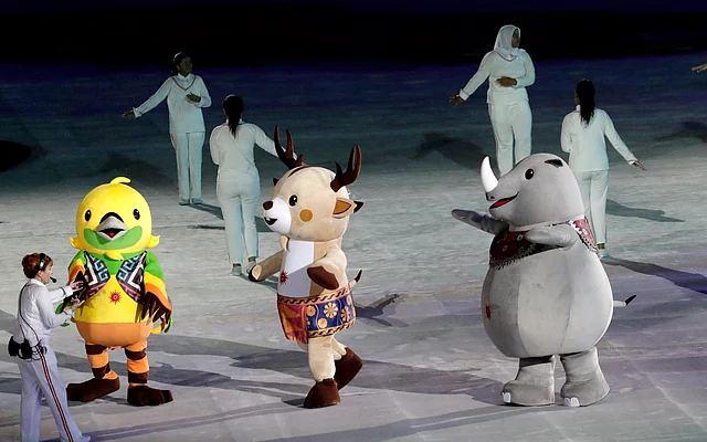 Games mascots march into the closing ceremony for the 18th Asian Games in Jakarta, Indonesia.