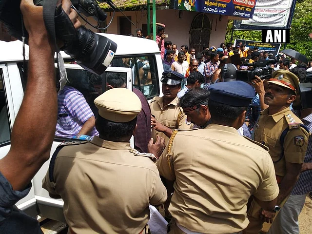 Police detain protesters at Pamba.
