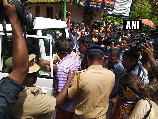 Police detain protesters at Pamba.