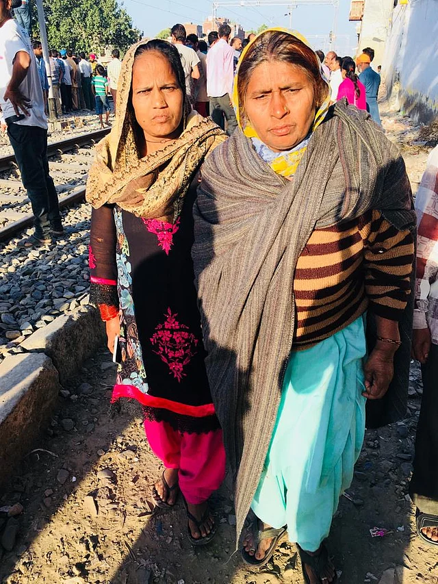 On the site of the accident, Vidya walks on by her friend and relative Rajkumari at her side.