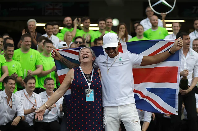 Mercedes driver Lewis Hamilton celebrates with his mother Carmen Larbalestier at the pit lane after the Formula One Mexico Grand Prix auto race at the Hermanos Rodriguez racetrack in Mexico City, Sunday, Oct. 29, 2017.