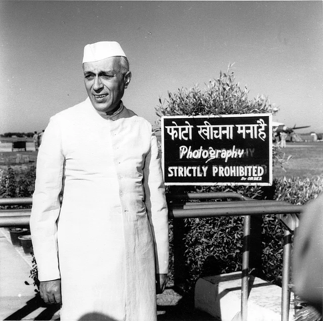Jawaharlal Nehru caught by the camera at Palam Airport, Delhi, while waiting for his sister, Vijaylakshmi Pandit, the Indian ambassador to Moscow, to arrive in 1954