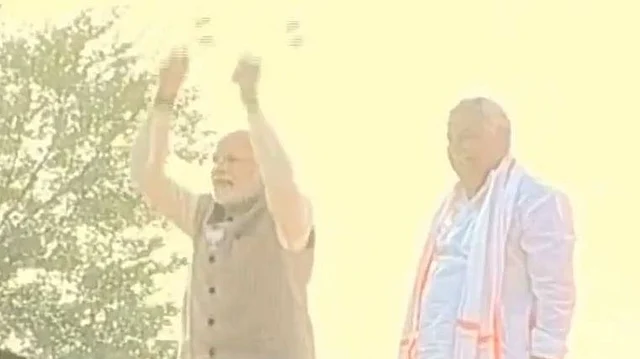 Modi playing the traditional drum in Rajasthan’s Dausar. 