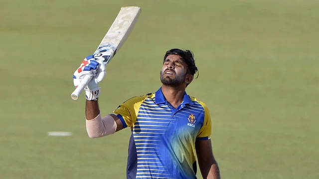 Ravikumar Samarth of Karnataka celebrates his century during a Deodhar Trophy match between India B and Karnataka at Himachal Pradesh Cricket Association (HPCA) stadium in Dharamshala on 5 March 2018. 