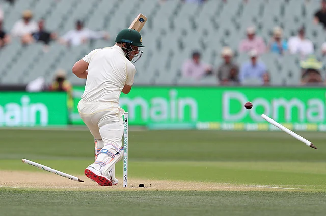 Australia’s Aaron Finch is bowled for no score during the first cricket Test between Australia and India in Adelaide.