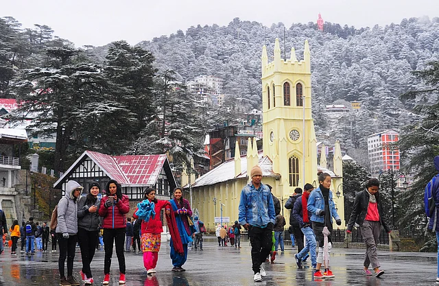Tourists at the Ridge after fresh snowfall in Shimla, Himachal Pradesh, on 12 December, 2018. Shimla received season’s first snowfall which has brought cheers on the faces of tourists and local hoteliers. 
