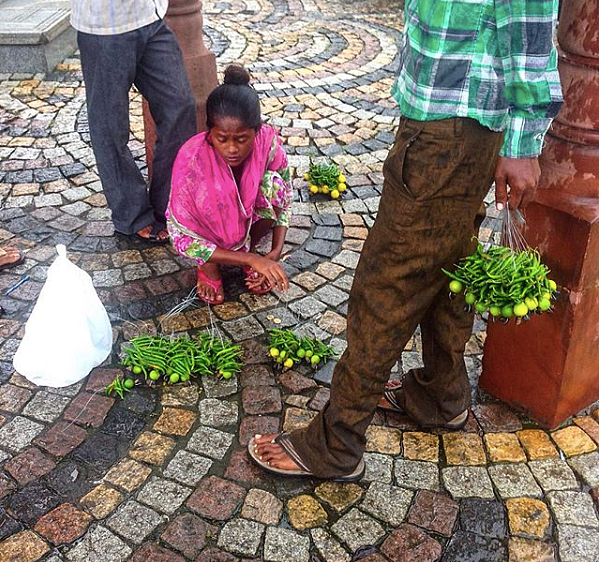 ‘Good luck’ lemons, chillies and charcoal for sale at a traffic light 
