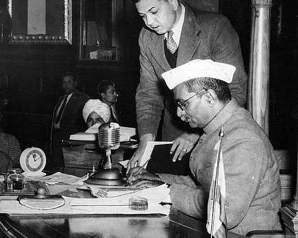 Rajendra Prasad signing a copy of the new Constitution at the Constitution Hall