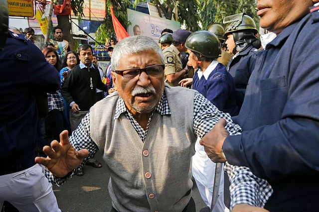 Policemen detain an elderly activist of the Communist Party of India-Marxist (CPI-M) during a rally on the second day of a two-day general strike called by various trade unions in Kolkata, on Wednesday, 9 January 2019. The strike had been called against the government’s alleged anti-worker policies and unilateral labour reforms.