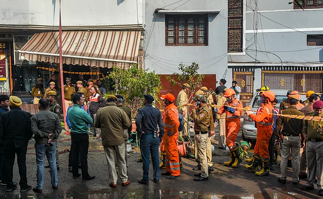 NDRF, firefighters and police officials seen at the site after a massive fire broke out at Karol Bagh’s Arpit Palace hotel, in which at least 17 people were killed and several injured in New Delhi.