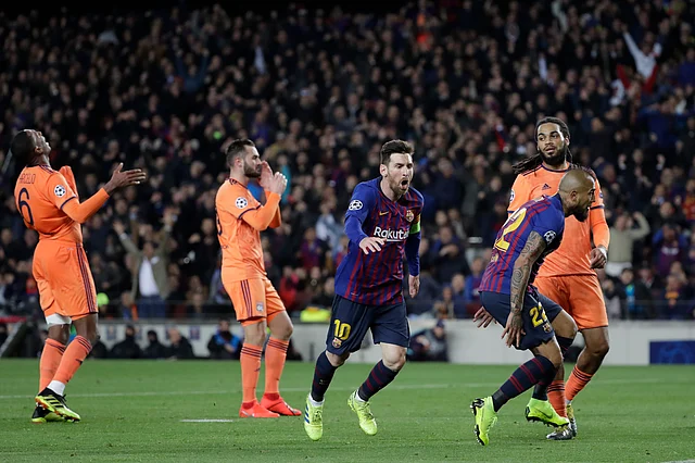 Barcelona’s Lionel Messi, centre, celebrates after scoring his side’s third goal during the Champions League round of 16, 2nd leg, soccer match between FC Barcelona and Olympique Lyon at the Camp Nou stadium in Barcelona, Spain.