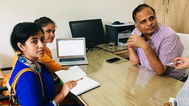 Petitioner Bhavya Singh with Delhi PWD Minister Satyendra Jain.