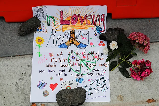 A message is displayed at a makeshift memorial outside Christchurch hospital in Christchurch, New Zealand, Saturday, 16 March 2019, one day after the mass shootings at two mosques in the city.