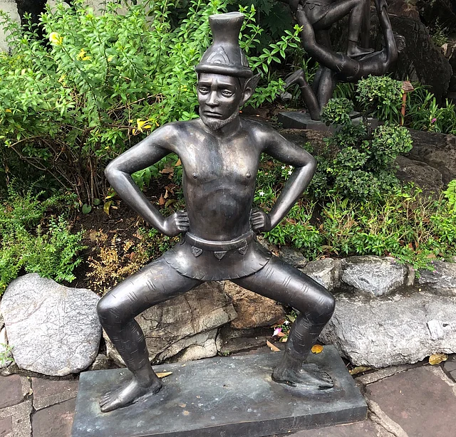 Statuette at the ‘Wat of Emerald Buddha’ is used to represent the bullies of Bangkok.