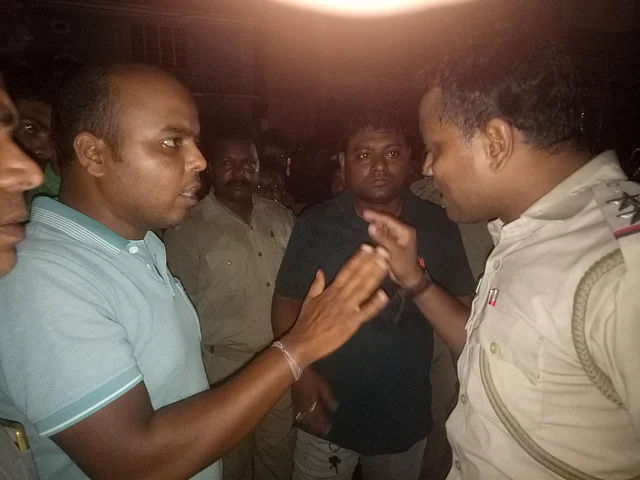 Police tries to pacify people from IRC Village area angry over delay in restoring power supply.