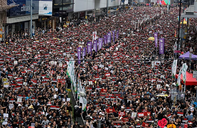 Tens of thousands of Hong Kong residents, mostly in black, have jammed the city’s streets Sunday to protest the government’s handling of a proposed extradition bill.