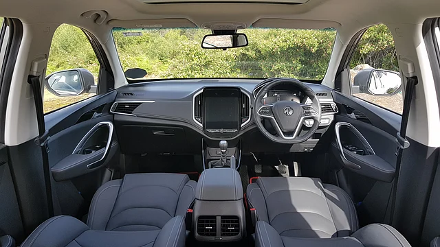 The interiors feature an all-black lower portion with beige for the roof, making it quite airy.