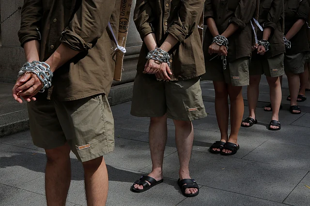 Students in chains protest in Hong Kong on Saturday, 8 June.