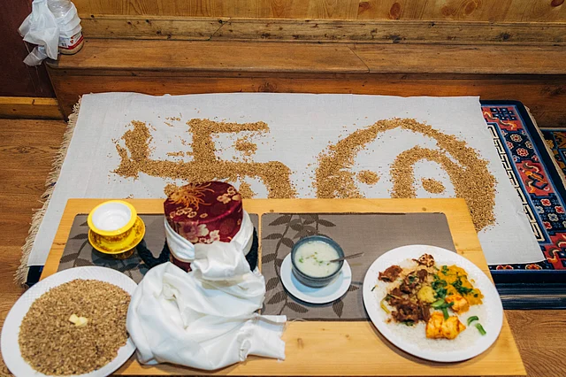 The bride and groom would be asked to stand on these two symbols drawn out by grains for the final rituals for a happy married life.