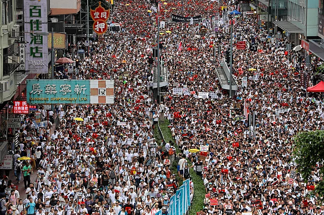 Protesters march against the proposed amendments to Hong Kong’s extradition law.