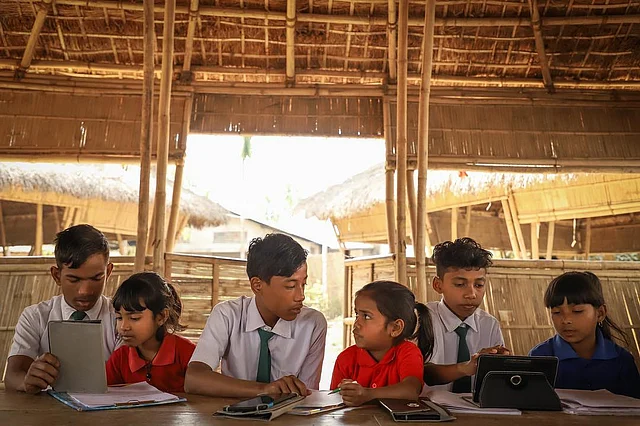 Older students teaching the younger ones at the Akshar school. 