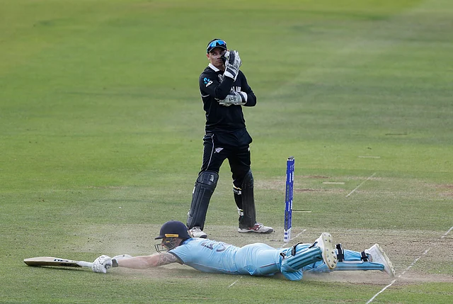 England’s Ben Stokes dives in to make his ground and get a 6 from overthrows during the Cricket World Cup final match between England and New Zealand at Lord’s cricket ground in London.