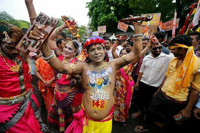 Devotees dance and celebrate during the annual festival of Rath Yatra.