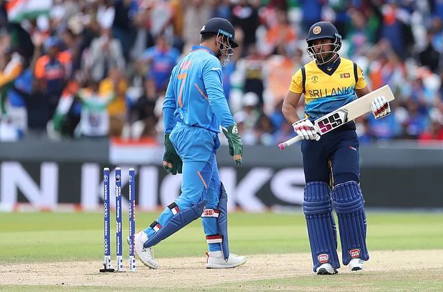 Sri Lanka’s Kusal Mendis, right, leaves the field after being dismissed by India’s Ravindra Jadeja during the Cricket World Cup match between India and Sri Lanka.