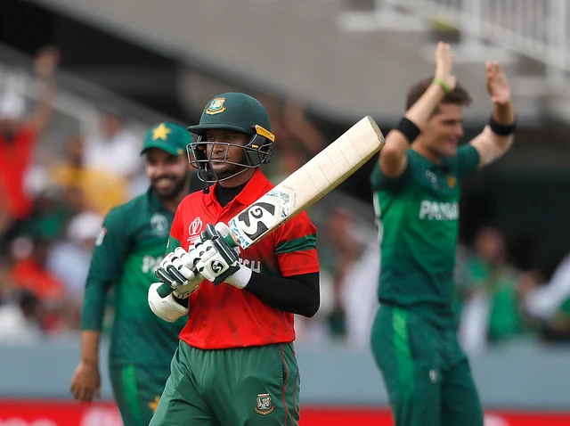 Bangladesh’s Shakib Al Hasan walks off the pitch after being given out caught behind off the bowling of Pakistan’s Shaheen Afridi during the Cricket World Cup match.
