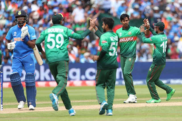 Bangladesh’s Mustafizur Rahman, second right, celebrates with teammates the dismissal of India’s Hardik Pandya, left, during the Cricket World Cup match between Bangladesh and India at Edgbaston.