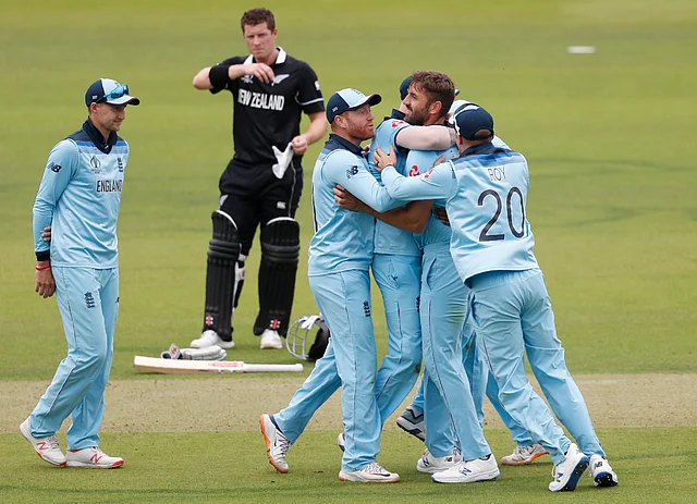 England’s Liam Plunkett, centre, celebrates with teammates after taking the wicket of New Zealand’s captain Kane Williamson caught behind during the World Cup final.