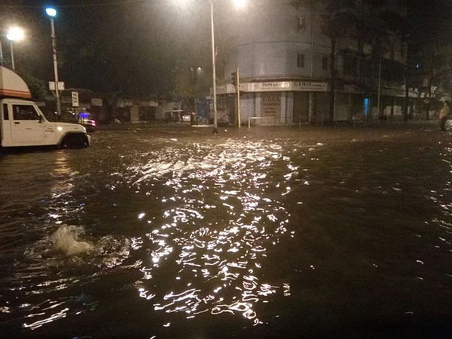Life is disrupted in Mumbai by the rains.